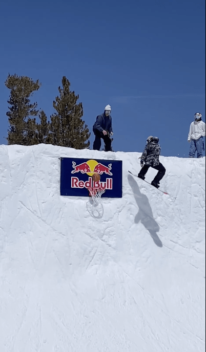Gravity-Defying Thrill: Snowboarder Sinks Epic Basketball Shot Mid-Air